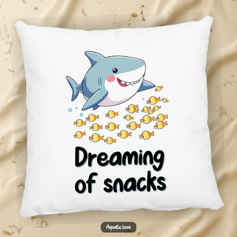 Funny pillow featuring a playful shark with small fins playfully chasing tiny fish, offering a fun and cozy accent.